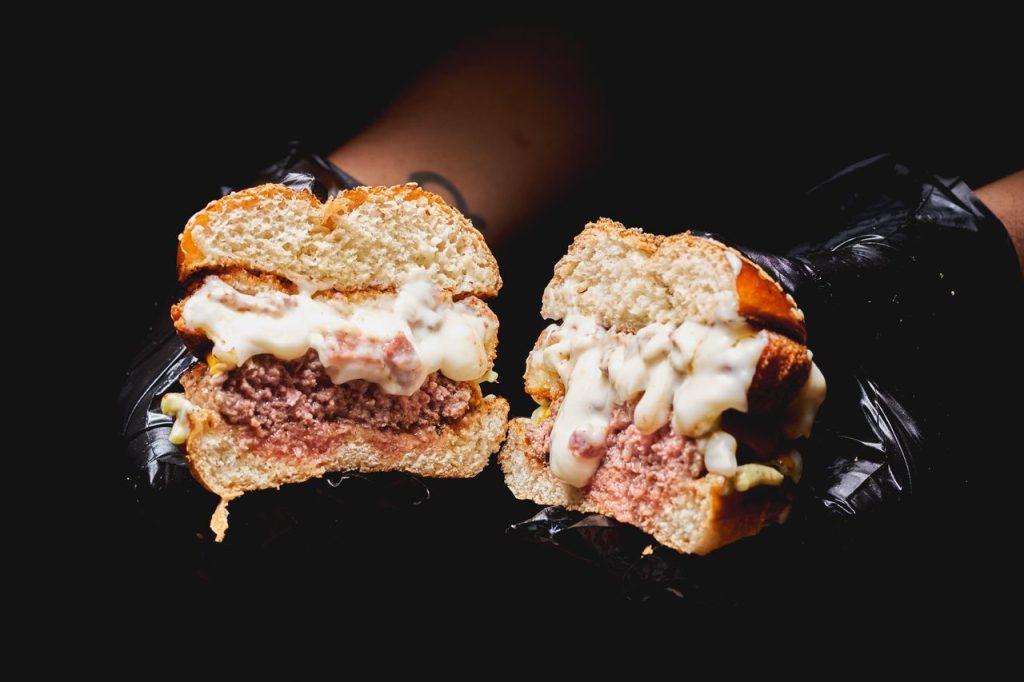 The Two Restaurants Take Different Approaches to Their Cheese-Stuffed Burgers
